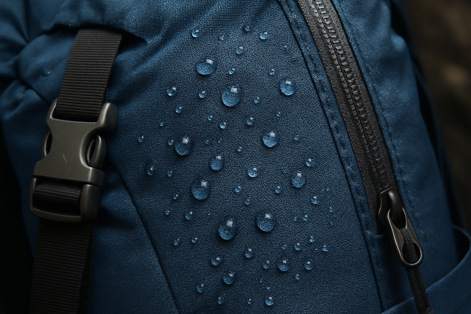 Close-up of a high-denier nylon fabric on a waterproof hiking backpack. Alt: lightweight waterproof hiking backpack durable fabric close-up