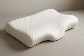 Ergonomic memory foam pillow shaped to support neck alignment. Alt: Memory foam pillow for neck pain cradle support image.