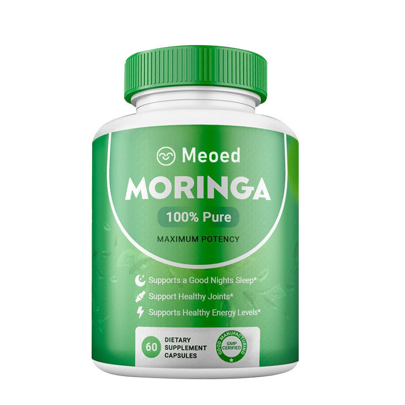Moringa supplement bottle with green label on a white background